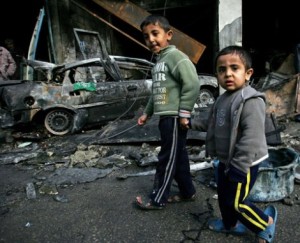 Children in Gaza walking aside a by Israel airattacks demolished mosque