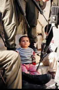 Little Child watching Occupatying Soldiers